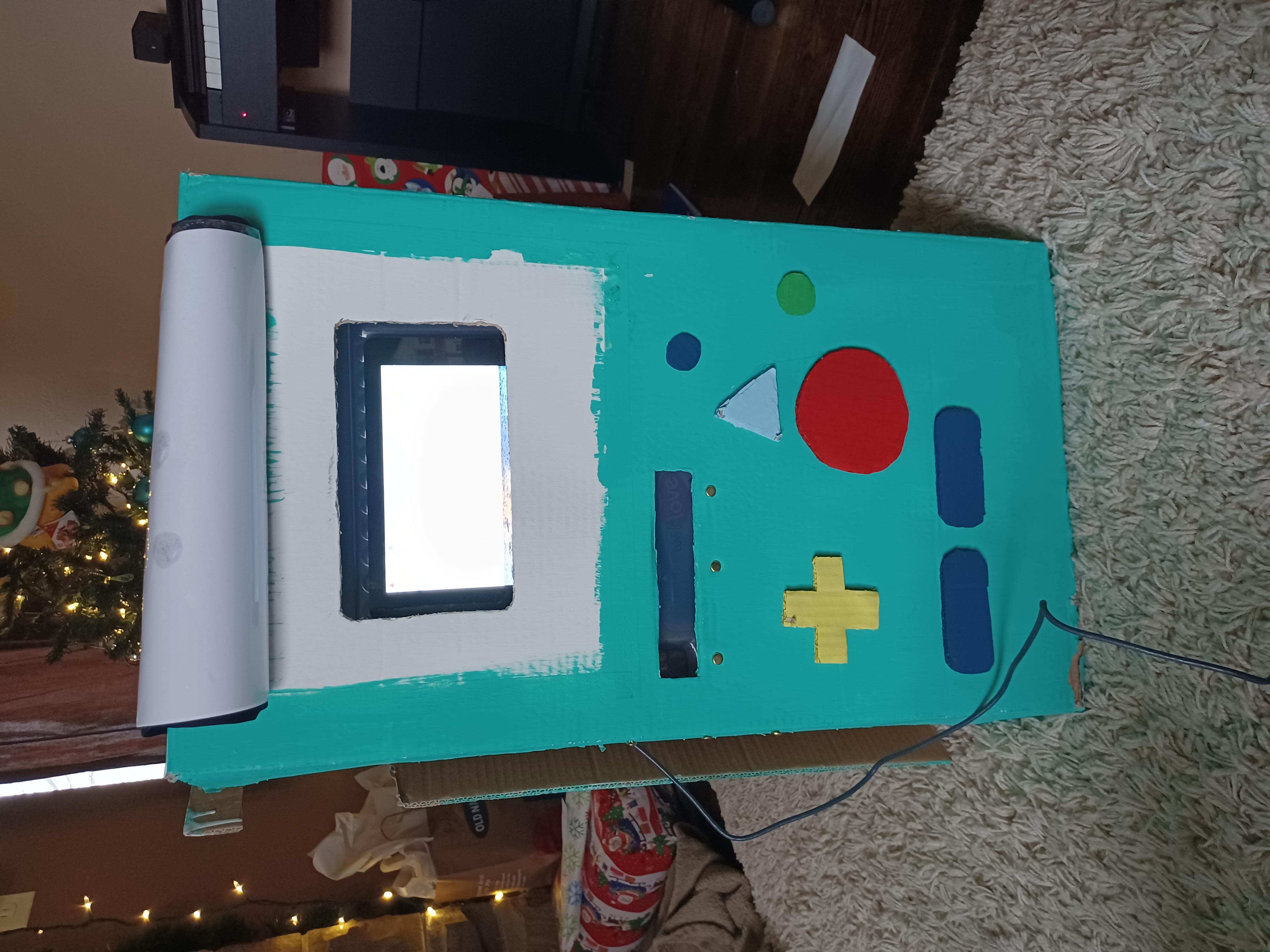 The paper that had BMO's face on it flips up to reveal a touch screen
