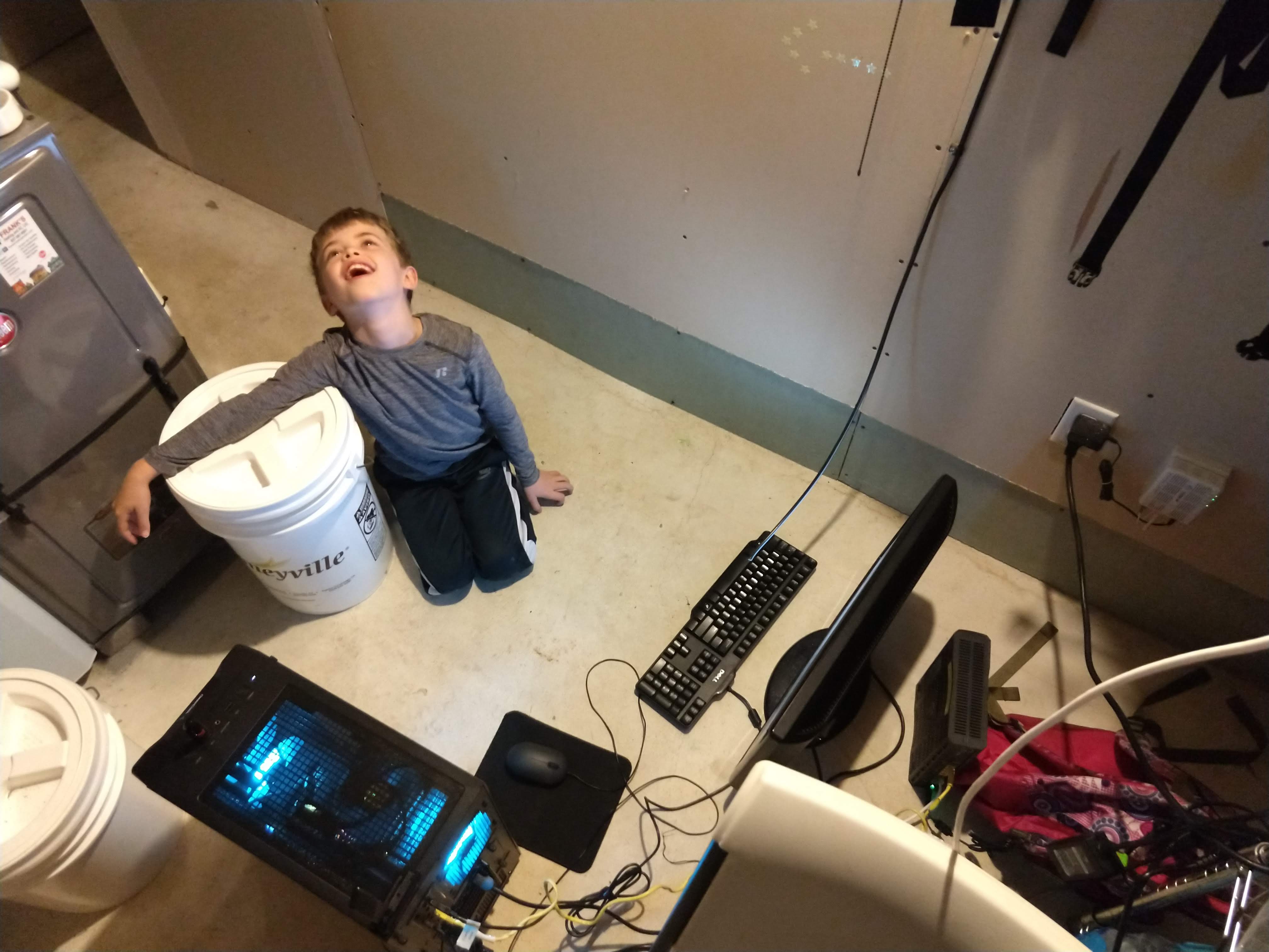 frustrated austin in the basement next to a computer on the floor