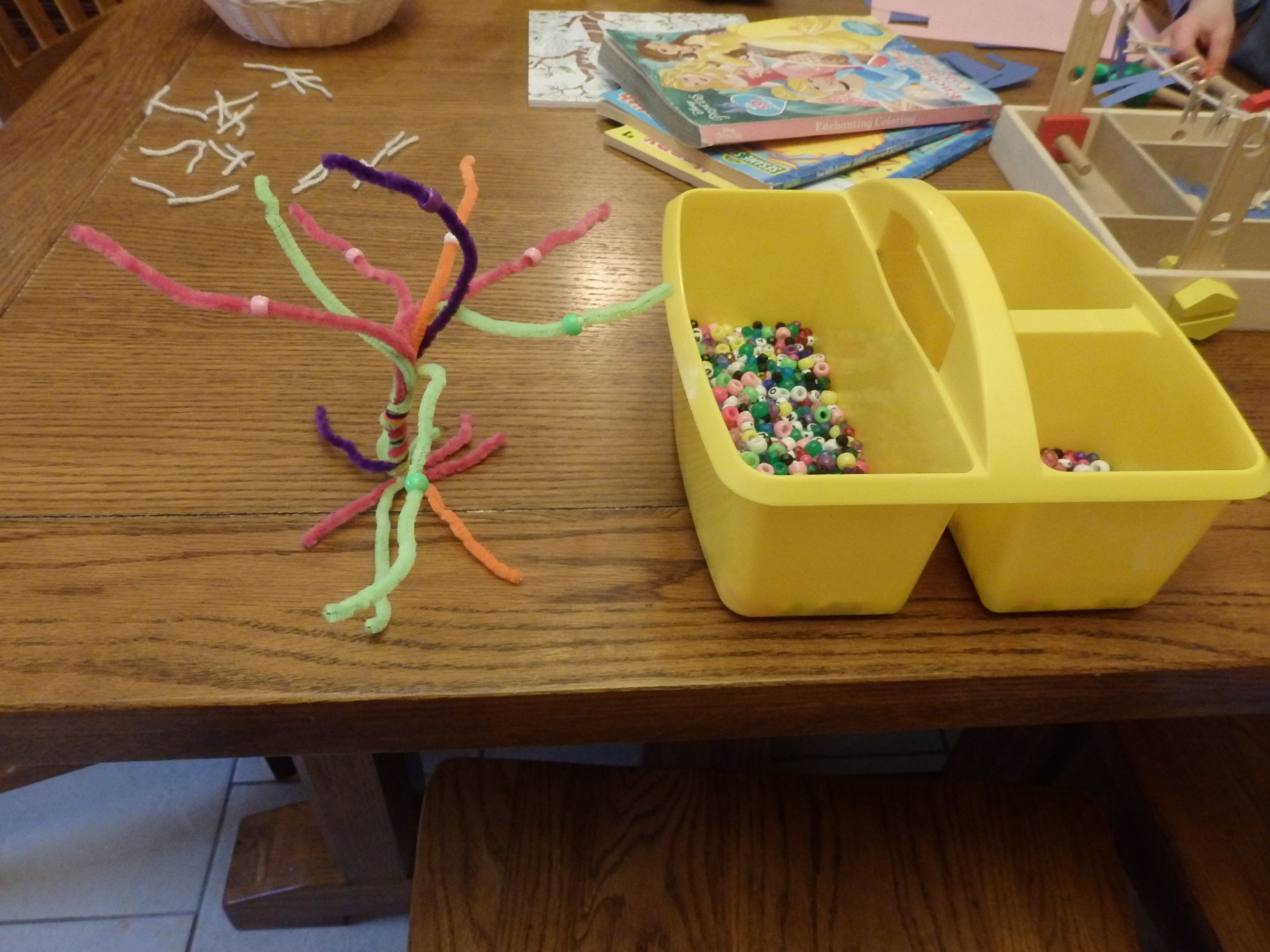 chenille stems twisted in the shape of a tree with pony beads to thread onto it