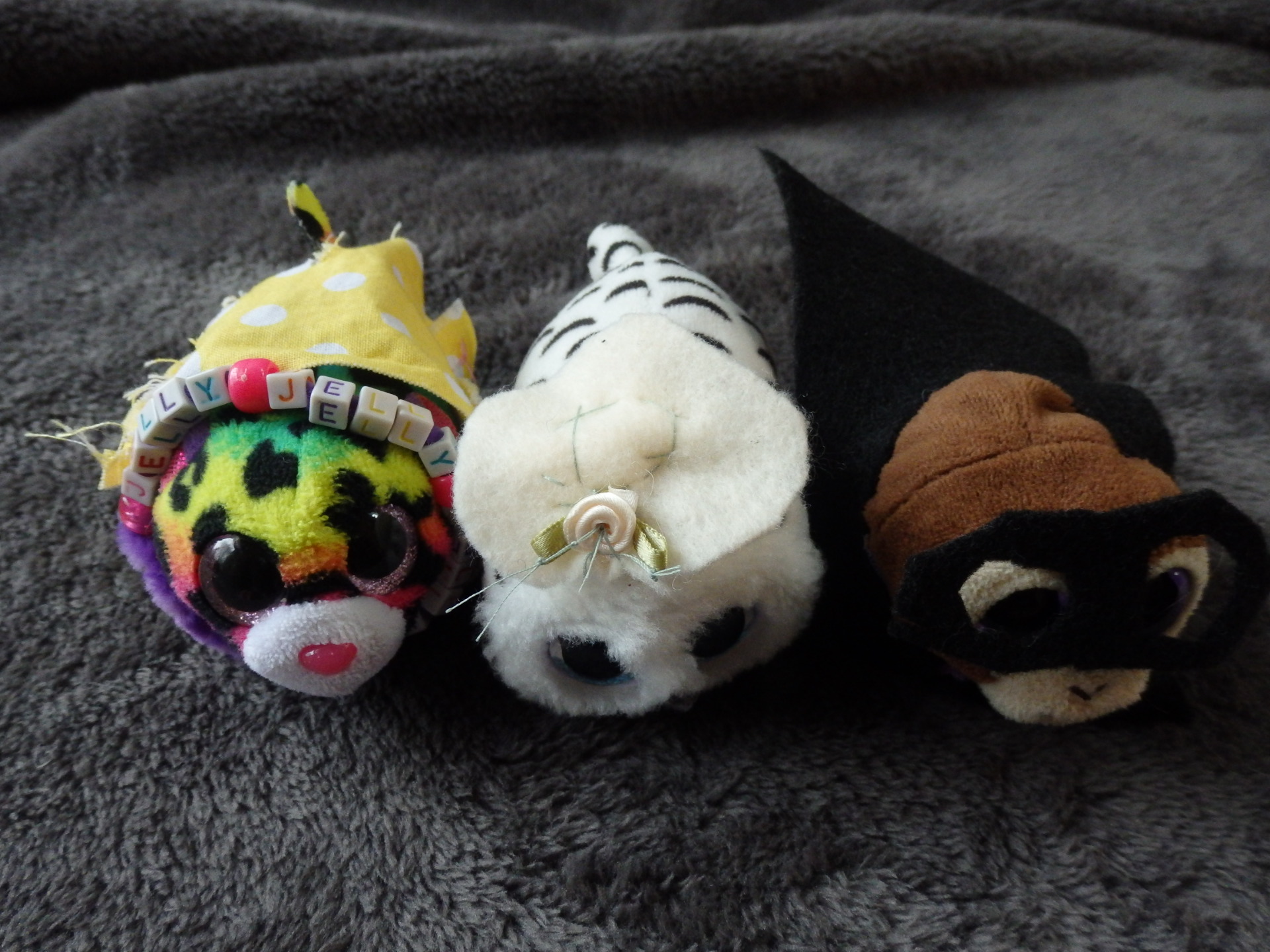 stuffed animals wearing hand-sewn clothes made by a child