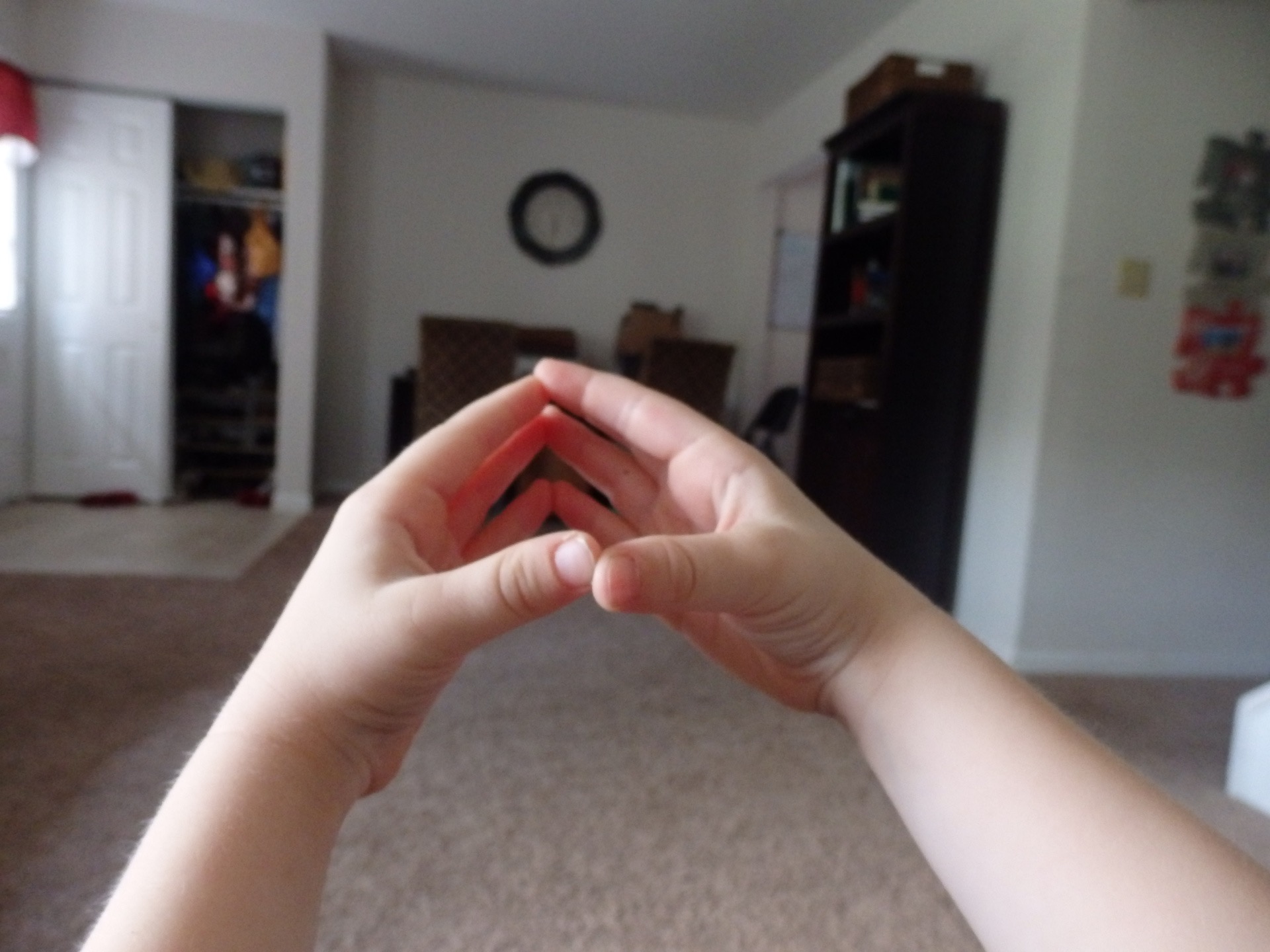 boy making a circle with his hands