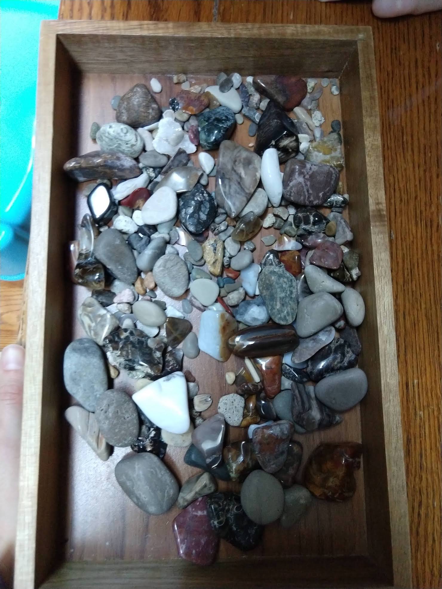 box of tumbled stones, of all colors