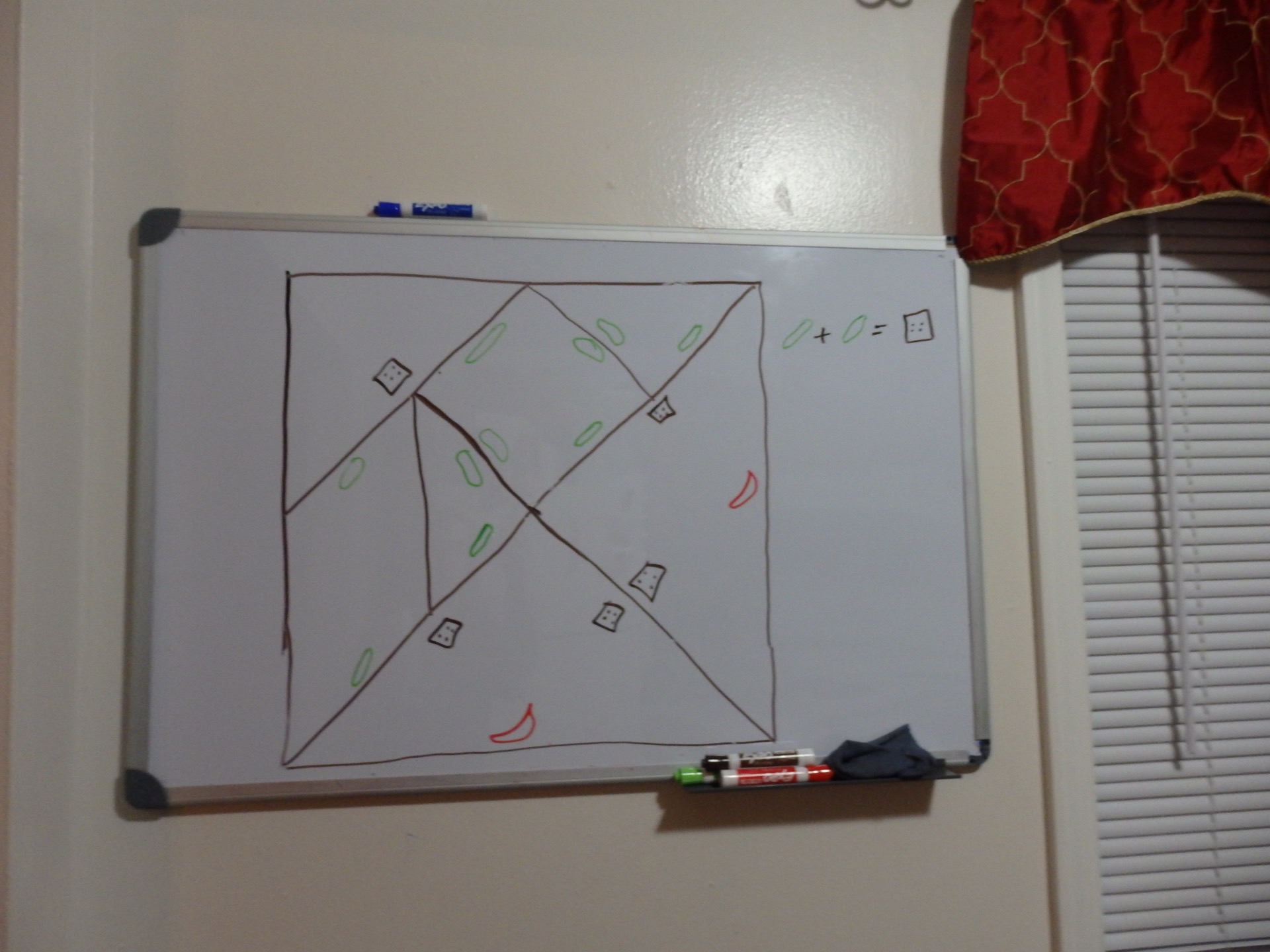 a tangram square with the sides labelled with pictures