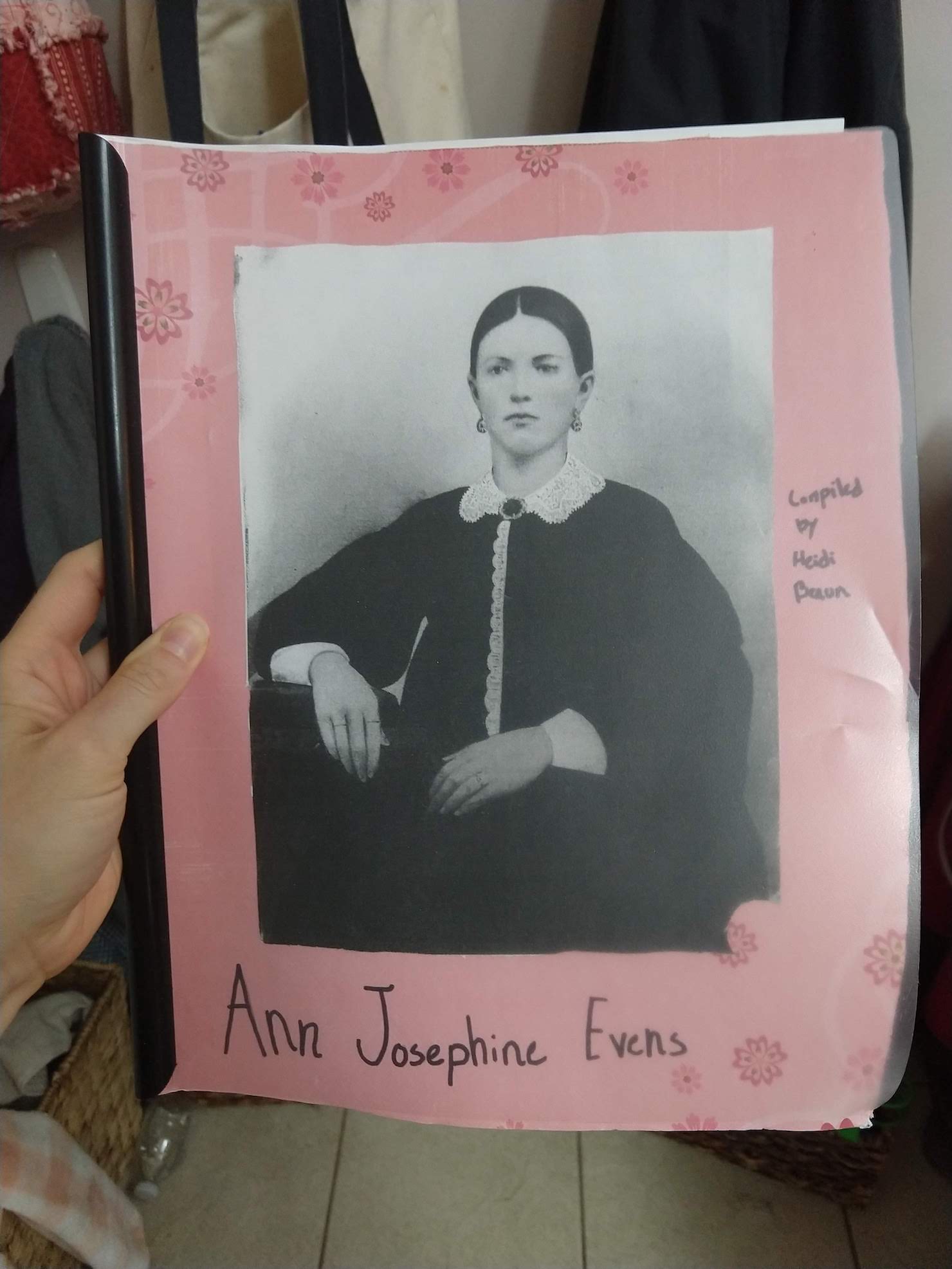 a scrapbooklet with an old picture of a young woman. her name, and my daughter's name.