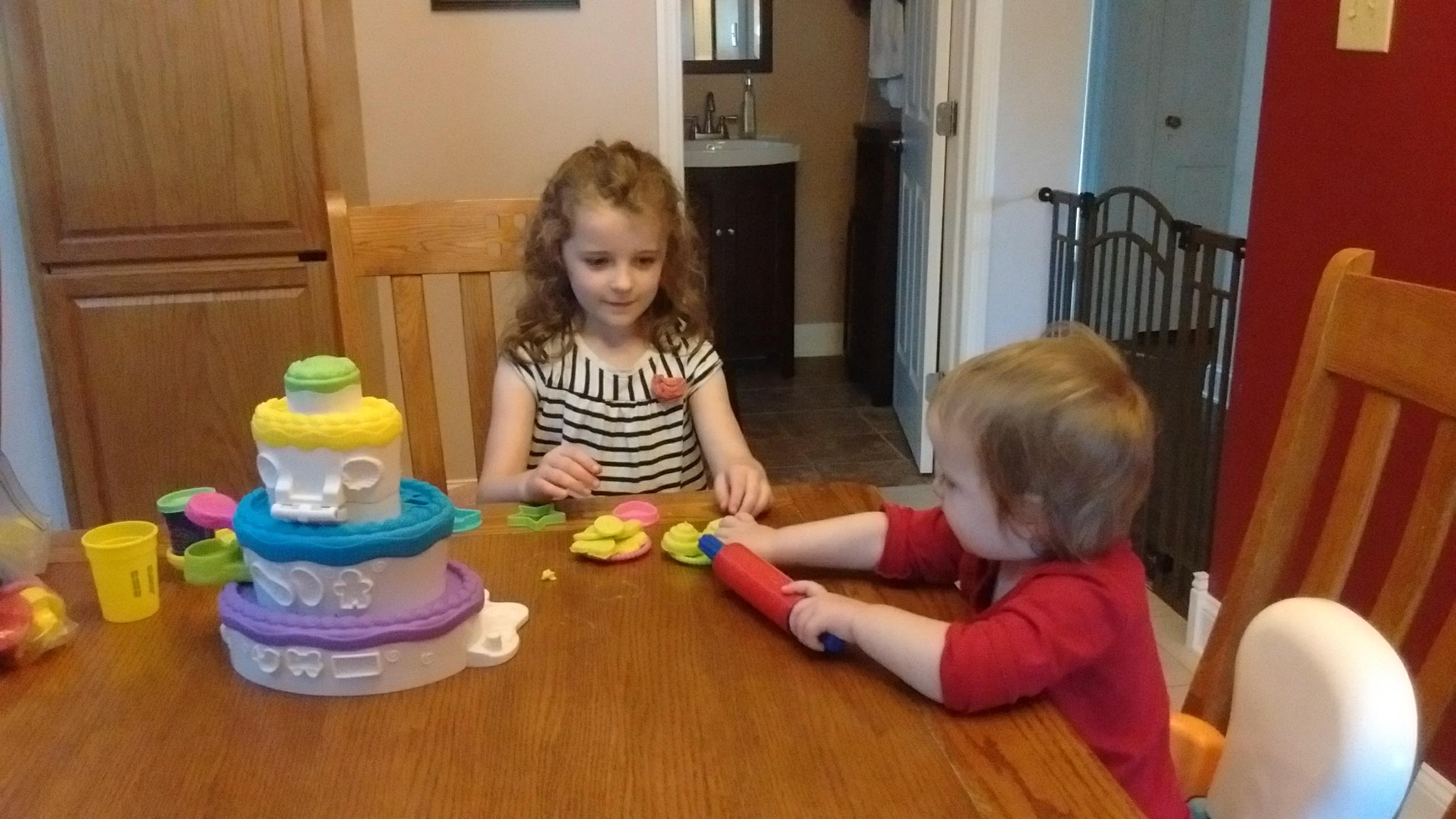 two children playing with playdoh