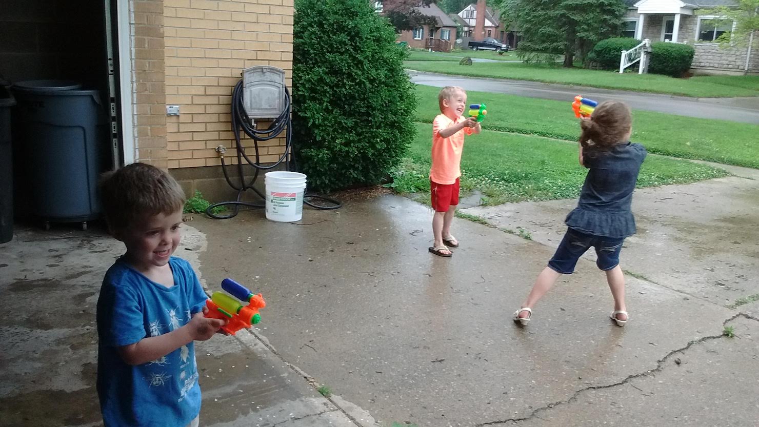 more children playing with squirt guns