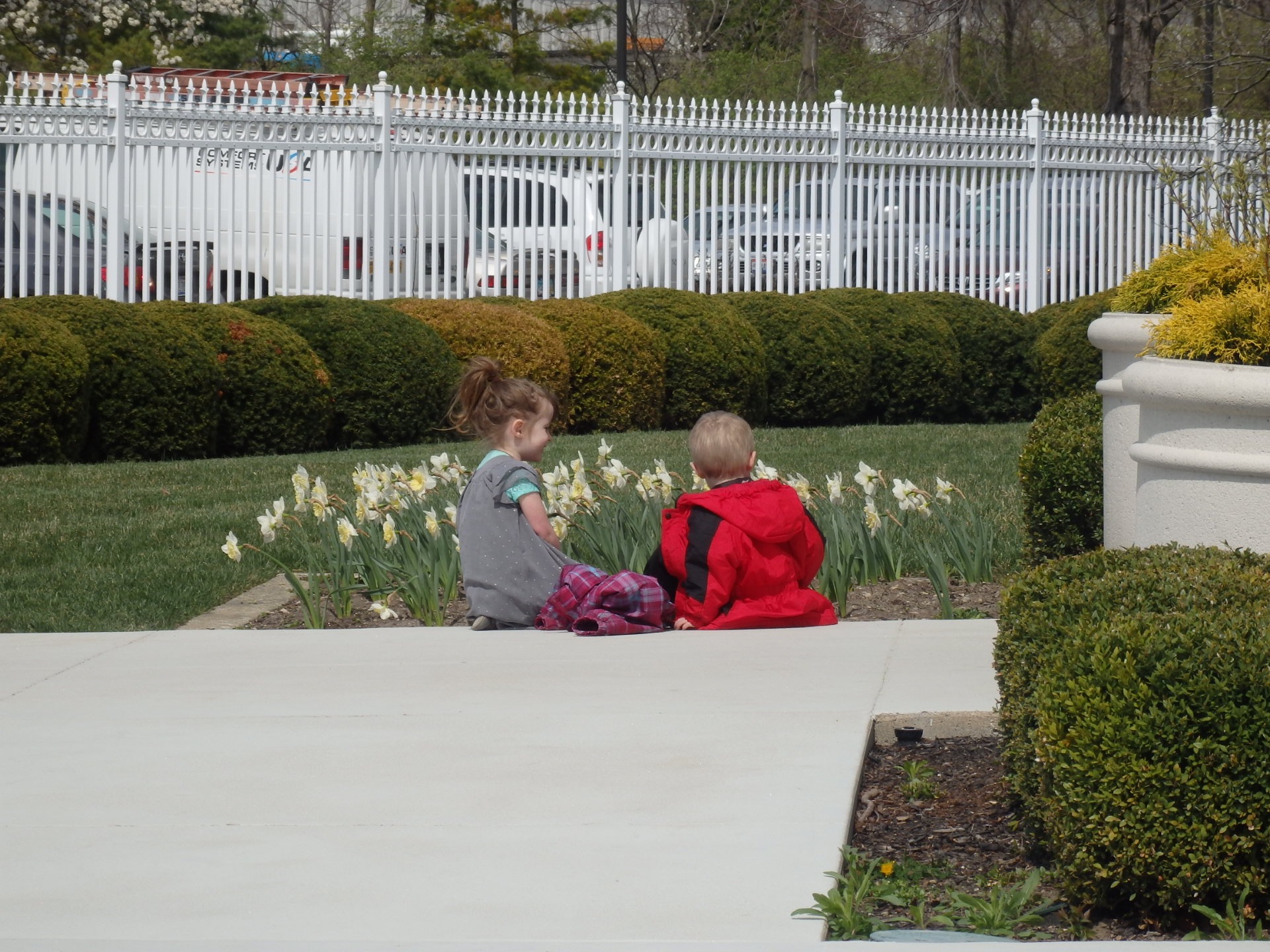 Heidi and Peter talking together near flowers