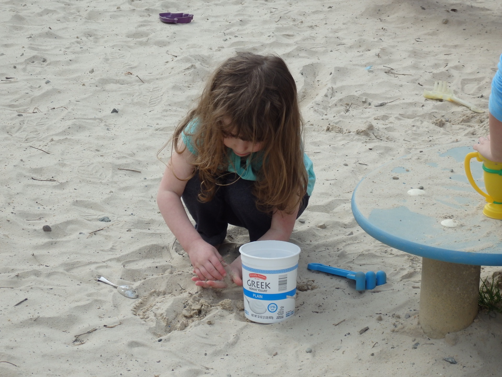 Heidi playing in sandbox