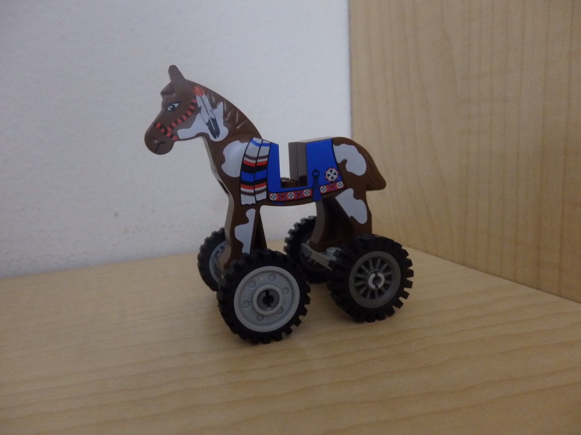 horse standing on wheels
