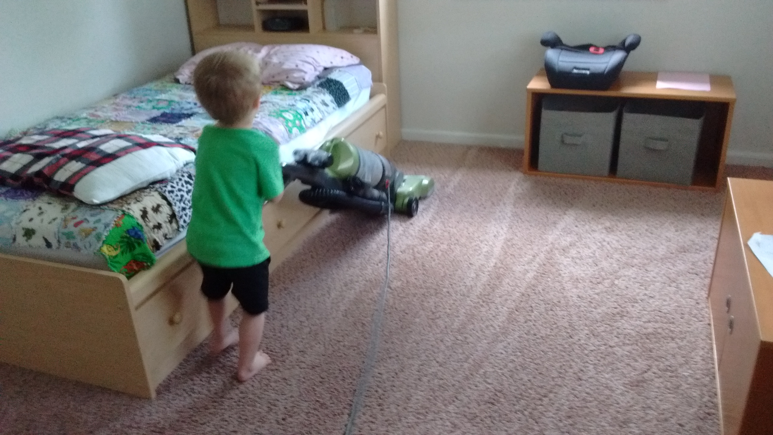 three year old peter vacuuming