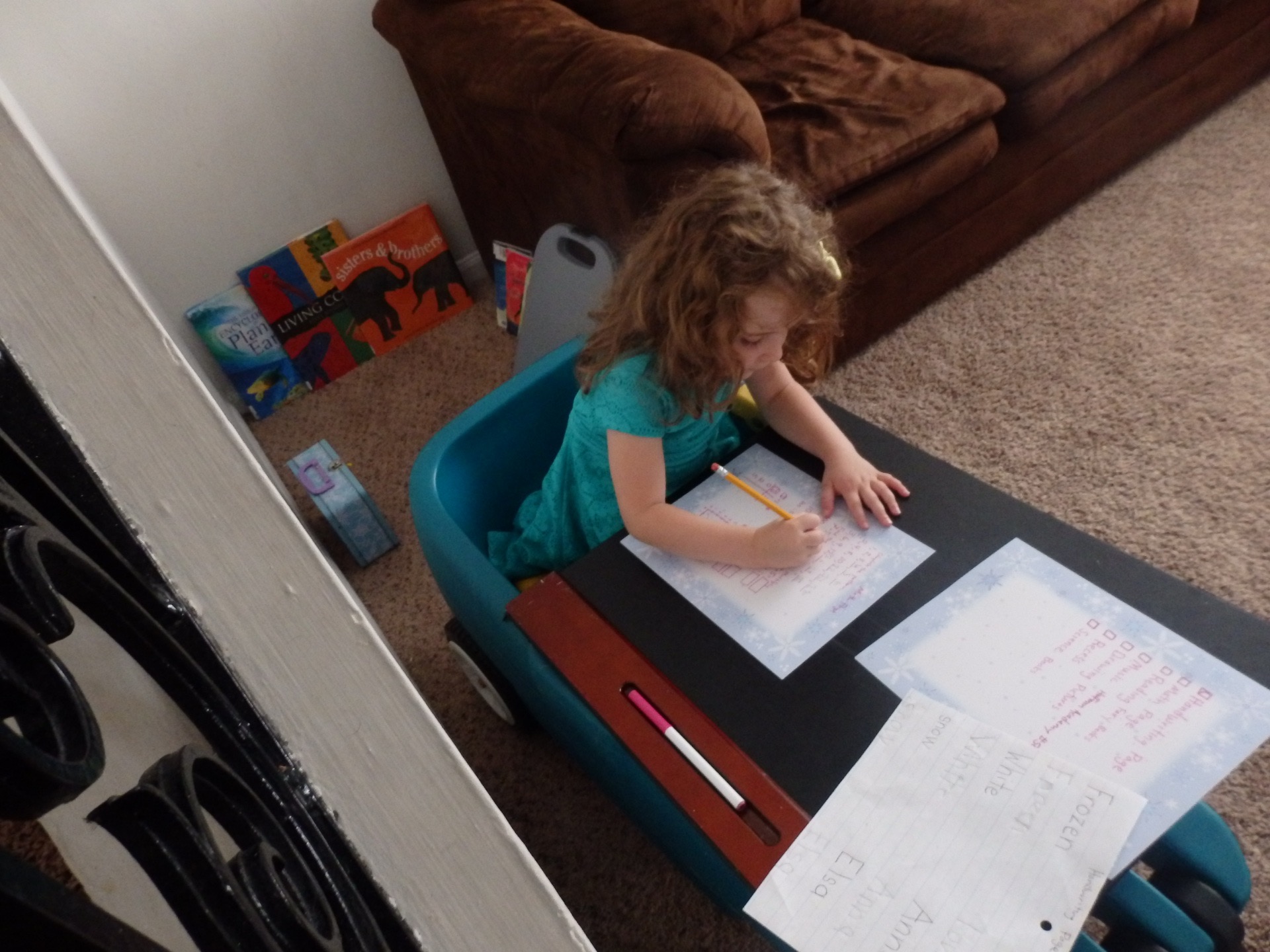 heidi working at a desk with books nearby