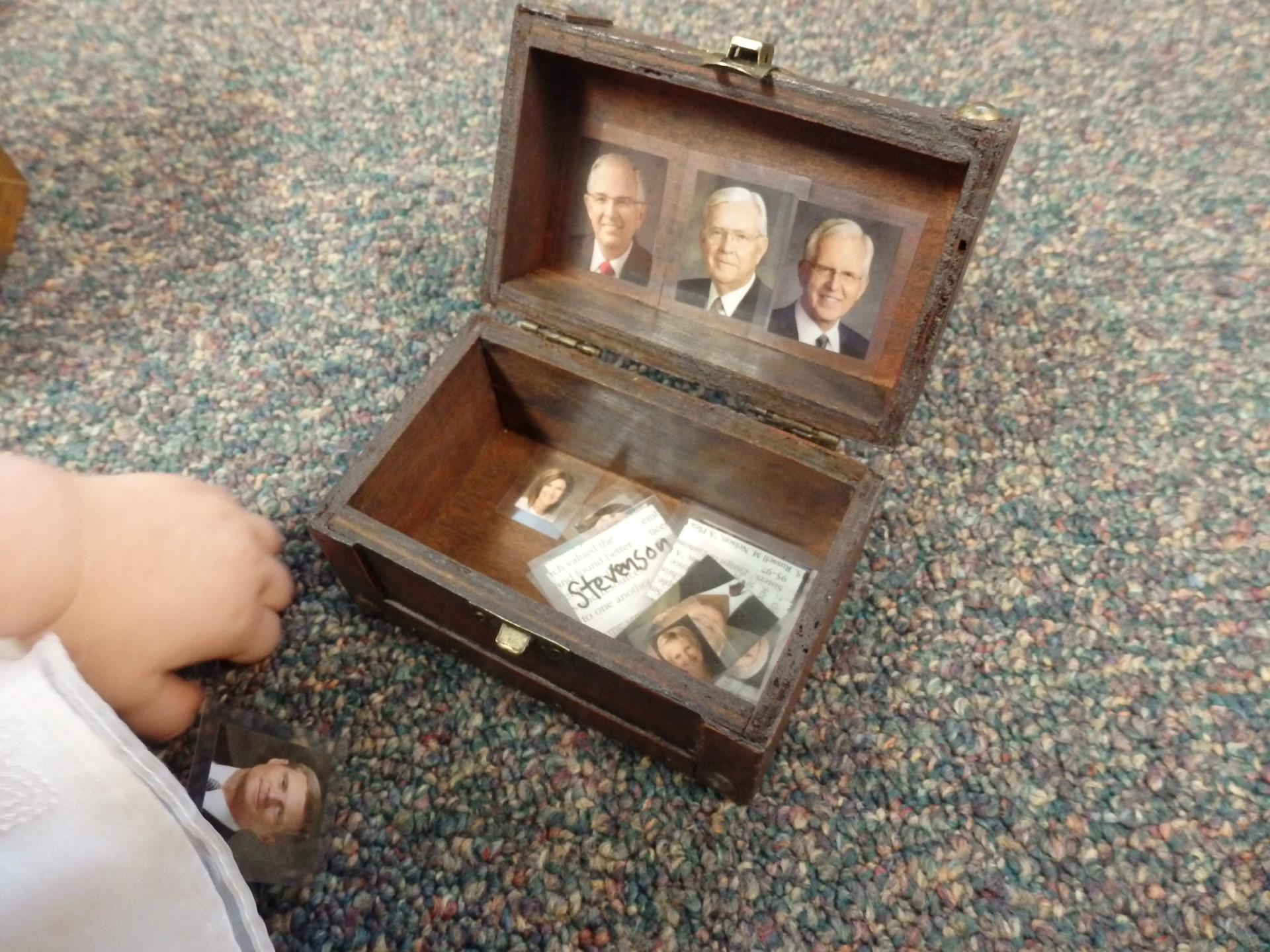 tiny treasure chest holding pictures of church leaders