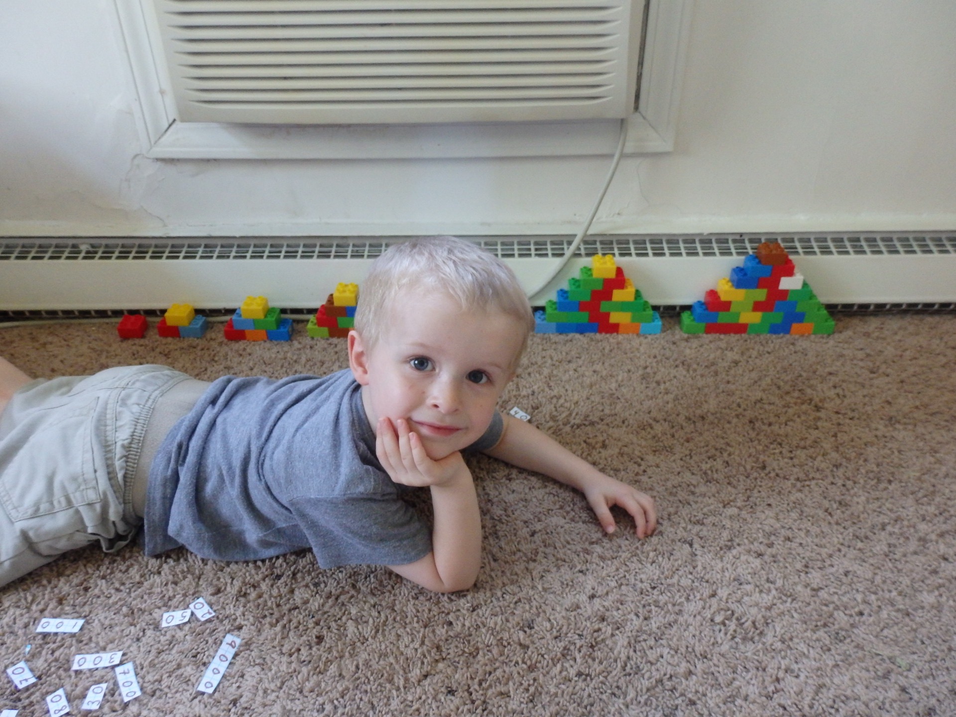 boy in front of pyramids of different sizes